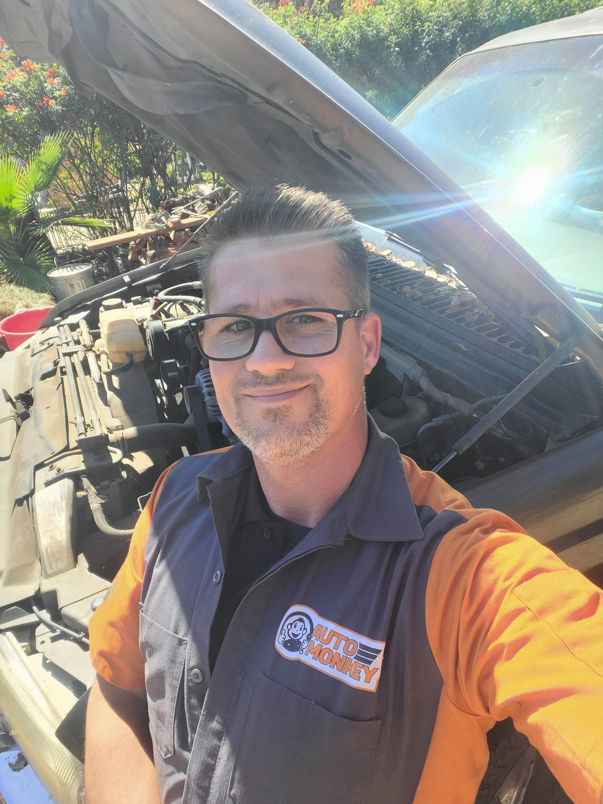 Mobile Mechanic working on brakes