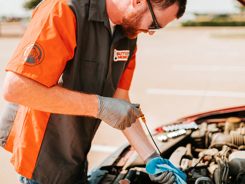 Auto Monkey mobile mechanic checking oil