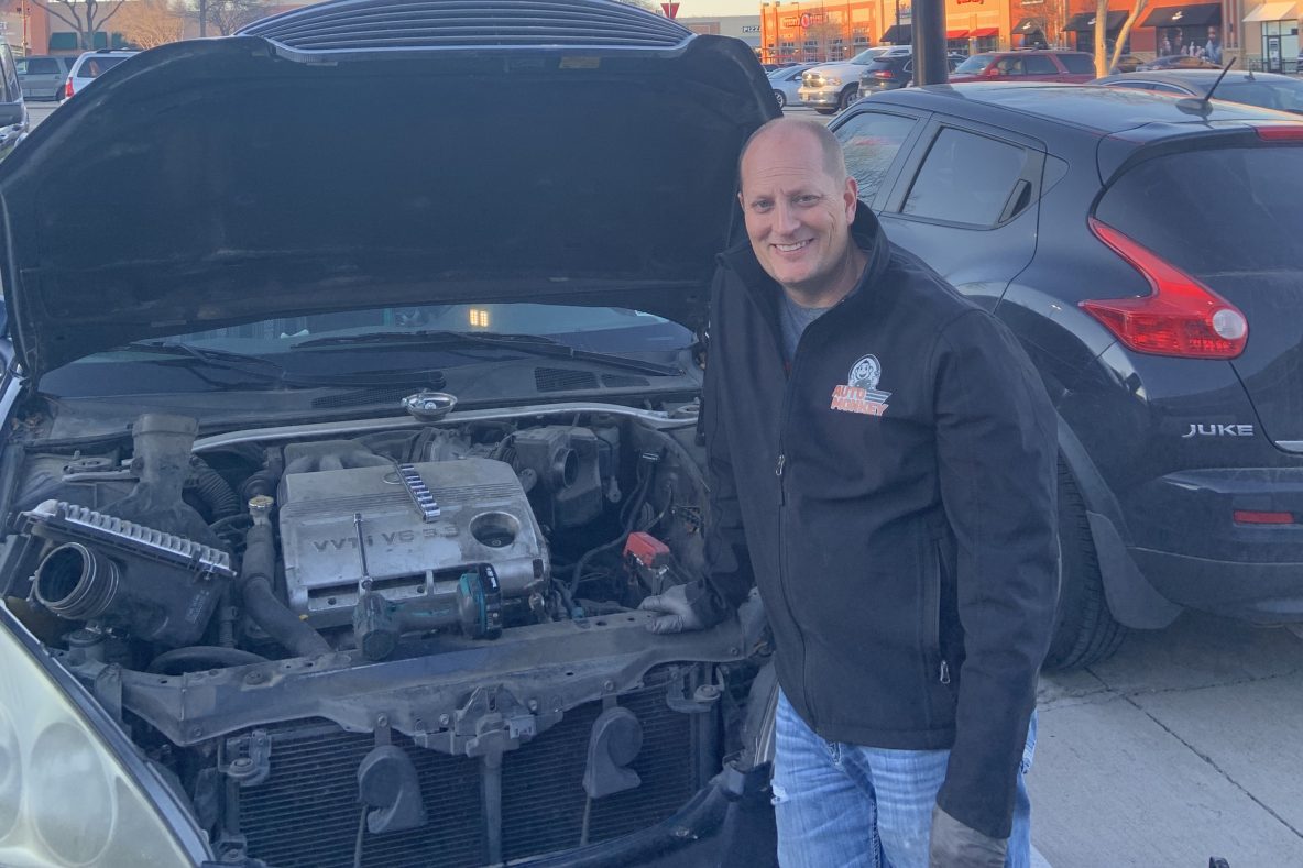 Car Repair in a parking lot by a mobile mechanic