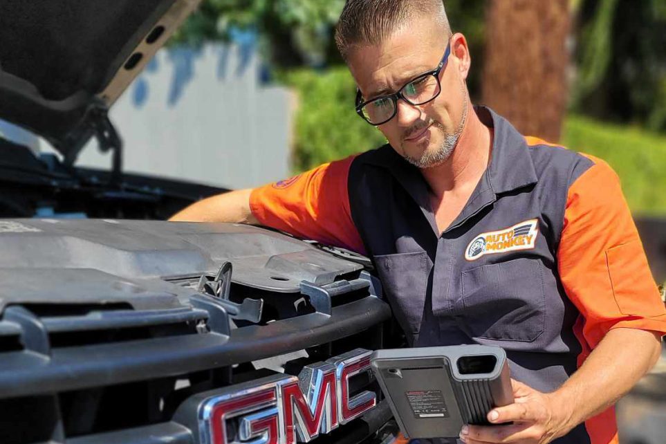 Auto Monkey technician diagnosing a vehicle