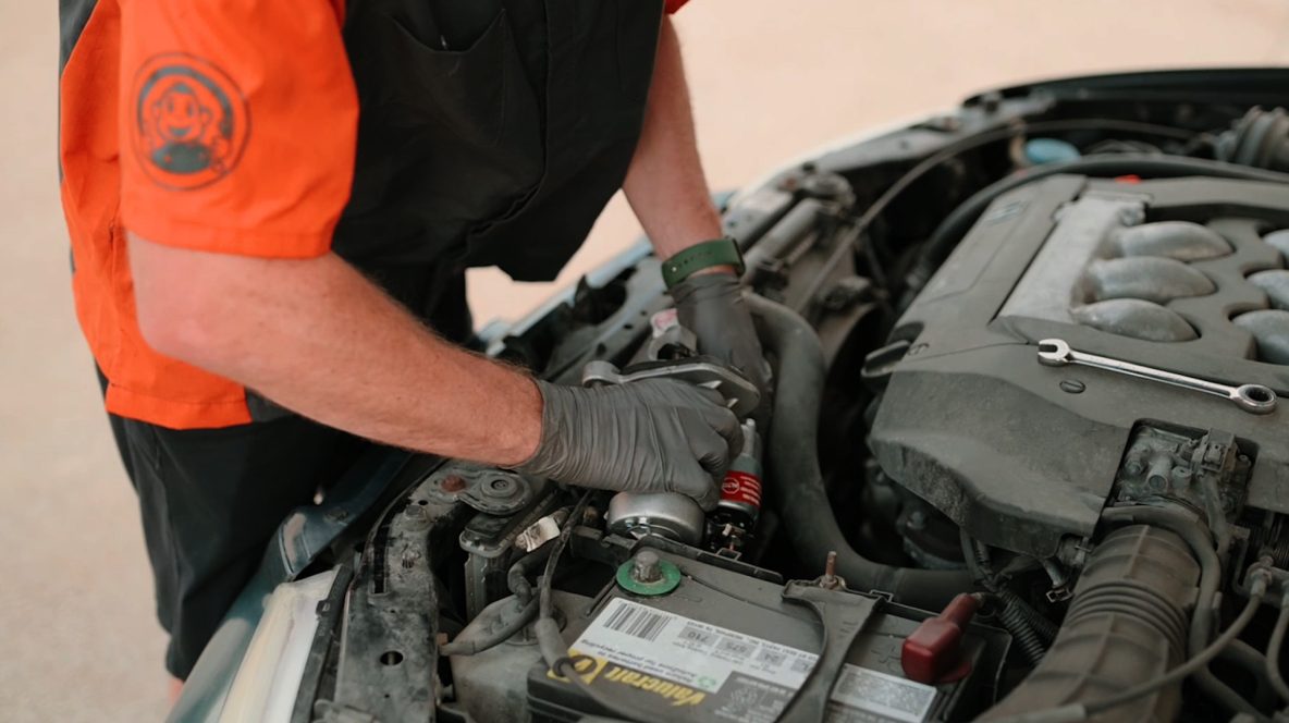 Auto Monkey Mechanic installing a starter motor on a Honda Accord